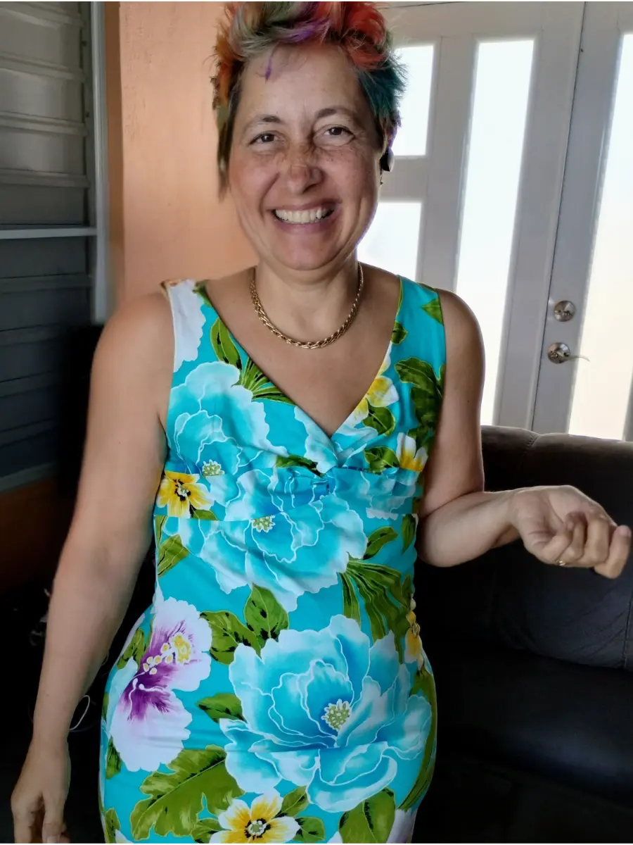 Michelle in a blue dress, providing guidance